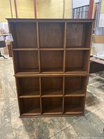 Front view of two stacked cabinets showing layout of cubby compartments