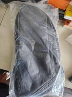 Bike trunk bag in plastic packaging showing front view