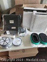 Lot showing multiple new filters and parts including vacuum and air/HVAC filters
