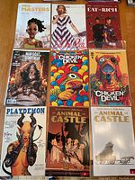 Top view of all 10 comic books arranged neatly on wooden surface showing detailed cover art and titles.