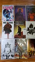 Lot overview photo showing nine comic books from House of Slaughter, Nocterra, and Radiant Black series.