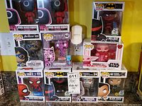 Full front view of all 10 Funko Pop figures sealed in box, neatly stacked showing characters and box details.
