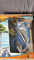 Photo showing the full snorkeling set in original Sea Doo packaging with mask, snorkel, and fins visible