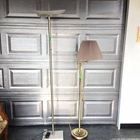 Full view of both lamps side-by-side showing the tall torchiere lamp and the shorter lamp with brown pleated shade.