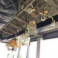 View of all four ceiling light fixtures hanging, showing different designs and shapes.