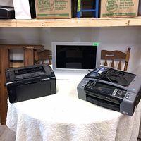 Photo showing the full lot of Sony TV monitor with two printers on a round table