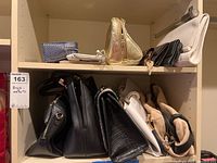 Multiple wallets and bags arranged on shelves showing sizes, colors, and variations.