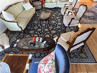 Full view of navy blue area rug under living room furniture