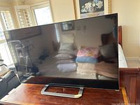 Front view of the TV on its stand