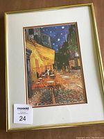 Front view of the framed print showing vibrant colors and gold frame.