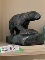 Front view of entire sculpture showing polar bear and seal on base