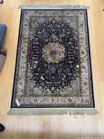 Top-down view showing full rug pattern, fringe ends, and overall condition