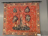 Full front view of tapestry hung on decorative rod