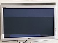 Front view of the 42 inch Fujitsu Plasmavision plasma TV mounted on the wall, showing the full screen and bezel.