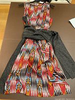 Full front view of sleeveless silk wrap dress with removable belt