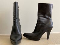 Pair of boots side by side, left and right view