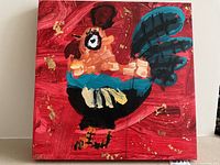 Front view of the abstract rooster painting on red background
