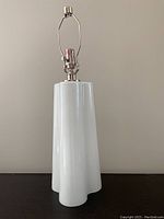 Front view of entire lamp on table surface against neutral background