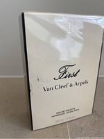 Front and side view of sealed box showing brand name, perfume name, and volume (60ml).