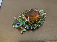 Angled front view showing overall turtle shape and rhinestone arrangement