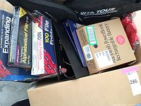 Photo showing alphabetical expanding file, 100 file folders, folder box, binders, and Macintosh PowerBook rechargeable battery box