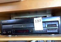 Front view of the black Pioneer LaserDisc player showing device front panel, controls, and display.