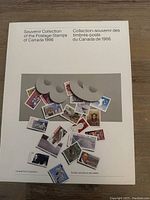 Front cover of the 1986 Canadian postage stamps souvenir collection folder showcasing scattered images of colorful stamps.