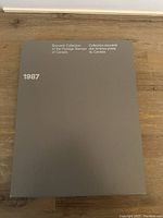 Closed front cover of the 1987 Souvenir Collection of the Postage Stamps of Canada folder, in a gray cover with white text.