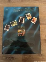 Front cover of the 1991 Canadian postage stamps souvenir collection booklet, showing featured stamps images on a blue-green background.