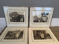 Four framed etchings displayed together showing rural and social scenes with people and cars.