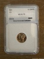 Photo showing the front of the encapsulated 1943 Mercury Dime with certification label indicating grade MS-64 FB and denomination 10 cents.