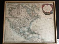 Full view of framed map showing North America and decorative frame