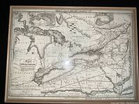 Full front view of framed map showing entire map surface and frame.