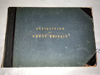 Front cover showing green cloth and leather binding with gilt title
