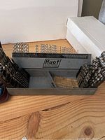 Front view of Huot drill bit storage case with drill bits arranged inside.