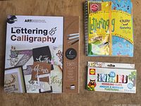 Overview of all three items: calligraphy kit, lettering kit, and modeling clay set
