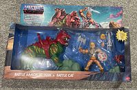 Photo of original sealed Battle Armor He-Man and Battle Cat boxed set with visible packaging artwork and included figures and accessories inside.
