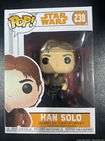 Front view of Han Solo Funko Pop #238 in original box showing branding and figure inside.
