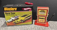 Closed Hot Wheels Sizzlers Race Case, Juice Machine device, and red car on top, showing external graphics and condition
