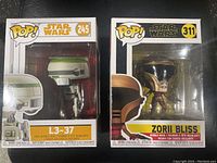 Two Star Wars Funko Pop figures in original boxes: L3-37 and Zorii Bliss.