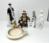 Lot display with six vintage collectible porcelain and ceramic items including Royal Doulton figurine, musical hobo clown, Lladro woman with baby pig, white porcelain farmer, and Hummel ashtray pieces.