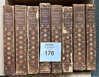 View of all 8 volumes showing spine titles and condition