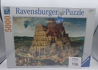 Front view of the sealed Ravensburger puzzle box showcasing The Tower of Babel image, 5000 pieces, brand and series info.