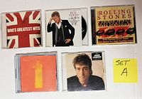 Top view of the 5 CD jewel cases showing full cover art for each album.