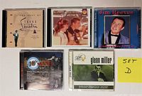 Front covers of five music CDs including Frank Sinatra, Memories From Heaven, Jim Reeves, 40's Mania, Glenn Miller, labeled as Set D.