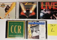 Front covers of the five CDs showing artist names and album artwork.