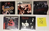 Front views of all 5 CD jewel cases showing album covers.