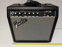 Front view of Fender Frontman 15G guitar amplifier showing controls and input/output jacks.