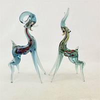 Both Mid-Century Modern art glass animal sculptures side by side, showing general shapes and colors