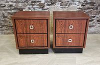 Front view of both nightstands showing two drawers each with square metal handles, faux rosewood finish, and black bases.